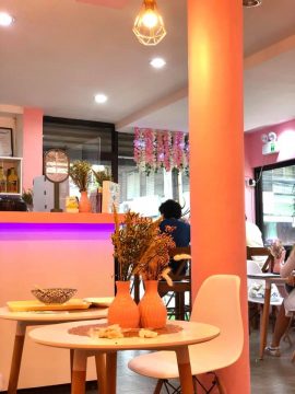 tables and seats inside the corner cafe