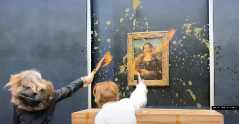 Activist throws soup to Mona Lisa Painting 